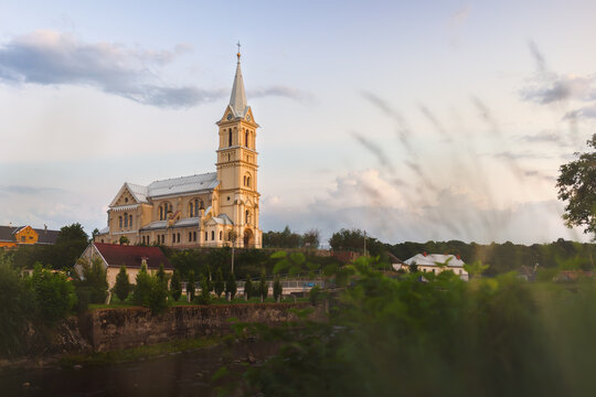 Scenic view of the monumental Neo-Gothic Church of St. Nicholas in Mikulovice standing on a hill above the Bela river near the Polish border.