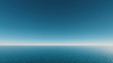 Obraz premium Tranquil Seascape with Clear Blue Sky and Calm Ocean Water on a Serene Horizon at Sunrise or Sunset for Nature and Travel Themes