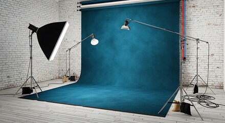 Studio setup with seamless blue backdrop, lights, and brick texture wall