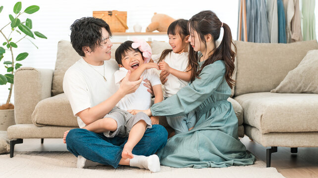 Family relaxing on the sofa at home, family, childcare (affection, family love)