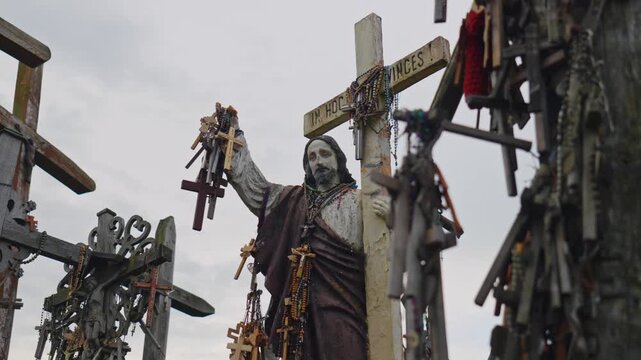 Large wooden crucifix among thousands of crosses in Lithuania.