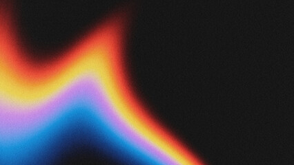 Naklejka premium A modern abstract background featuring a vibrant, grainy gradient of blue, purple, yellow, and red hues against a solid black base. The textured noise effect adds depth and visual interest.