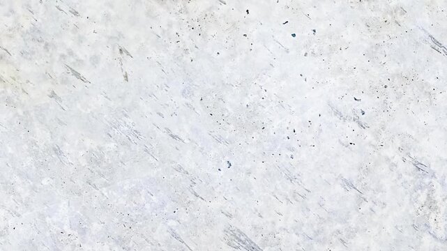 White crumpled paper background texture. Stop motion animation. Seamless looping.Close up of a crumpled piece of white paper showing texture and subtle shadows across the surface.