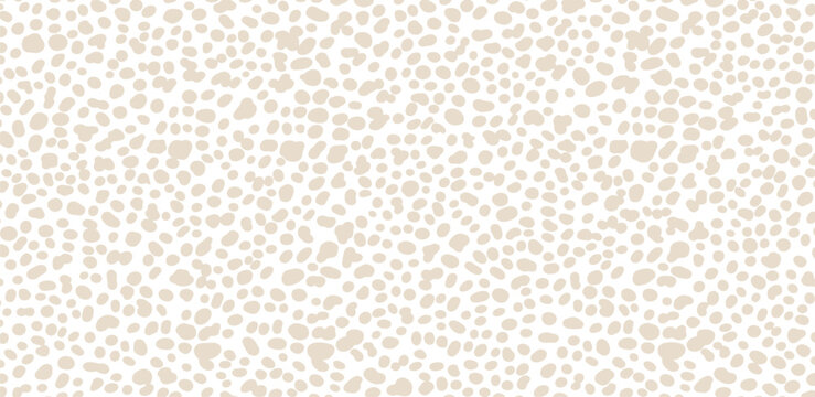 A close-up view of a spotted animal hide pattern, texture, and design on a natural surface