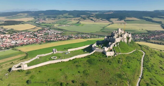 4K locked down hovering motion aerial drone view of the ruins of Spis Castle in eastern Slovakia, castle is situated above the town of Spisske Podhradie, UNESCO Heritage listed site, Spis, Slovakia
