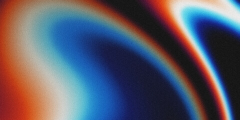 An abstract background featuring a smooth, grainy gradient that blends warm orange and cool blue hues. The textured, noisy appearance creates a modern, atmospheric effect. © yun visual