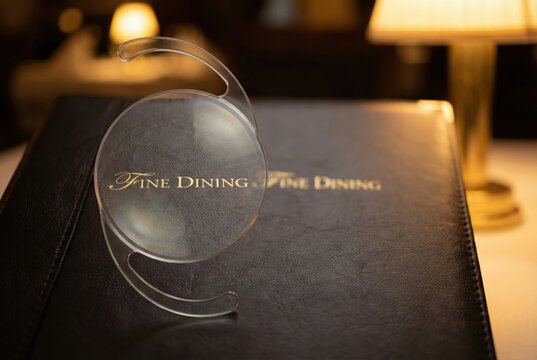 Intraocular lens magnifying fine dining menu in restaurant