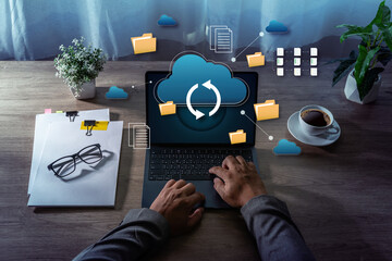 Cloud Storage Data Synchronization File Management on Laptop cloud storage and data synchronization icons representing business technology and remote work.