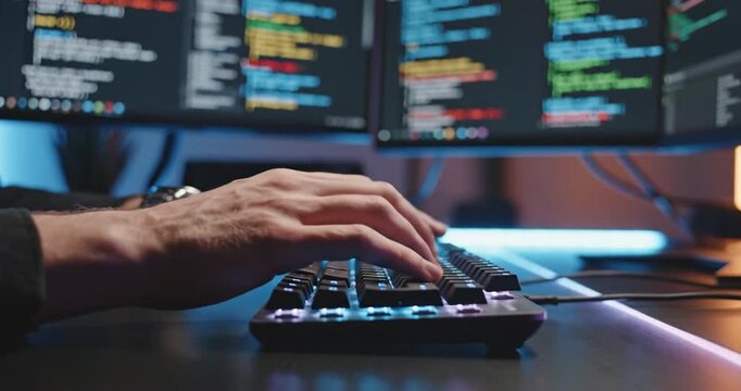 Person typing on a keyboard.