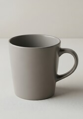 Obraz premium Minimalist ceramic mug casting gentle shadow with matte neutral tone