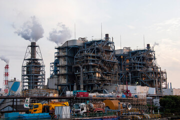 Fototapeta premium High-Rise Industrial Plant Structure with Smoke Stacks
