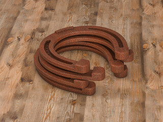 Horseshoes on wooden background
