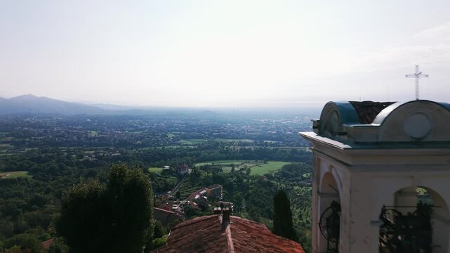 Sanctuary of the Blessed Virgin of Mount Carmel on a hilltop in Montevecchia, Italy. Aerial backward, copy space