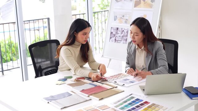 Woman architect designer teamwork select material compare samples finishing. Female interior creator choosing renovation materials with swatch spectrum.