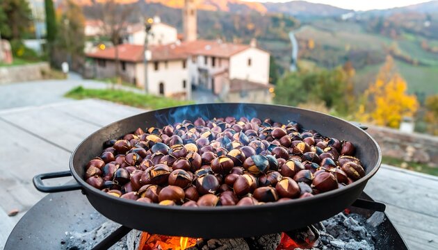 Roasted chestnuts in a pan over an open fire, with village backdrop