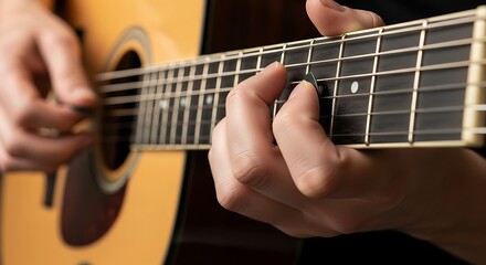 Obraz premium Closeup of fingers playing acoustic guitar for artistic expression