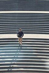 Business, man and travel with phone call on steps for discussion, real estate and negotiation. Below, realtor and stairs with mobile for commute, contact client and viewing schedule for buyer inquiry