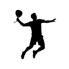 Obraz premium Silhouette of a man playing badminton, jumping and hitting the shuttlecock