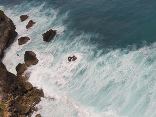 Dramatic ocean cliff with crashing waves Bali coast © dani