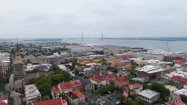 Drone shot pushing in on Downtown Charleston and the Arthur Ravenel Jr Bridge.