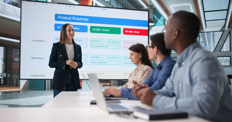 Diverse Team Of People In Office Meeting Listening