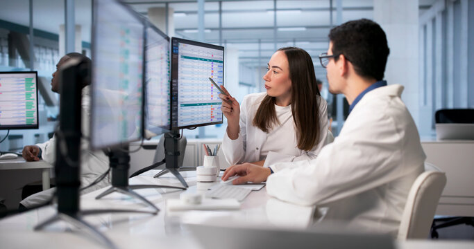 Medical Professionals Utilizing Advanced Technology To Analyze Patient Data