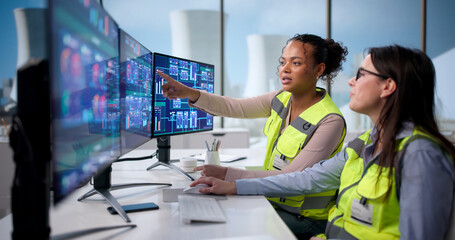 Young African American Woman Monitors Nuclear Plant