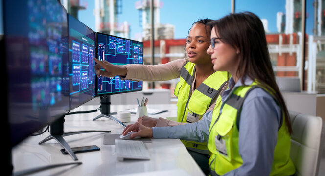Young Black Woman Engineers Monitor Automation Systems