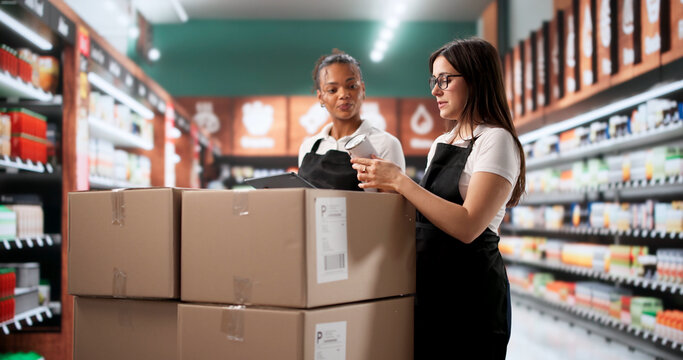 Expert African American Woman Guides Diverse Supermarket Staff