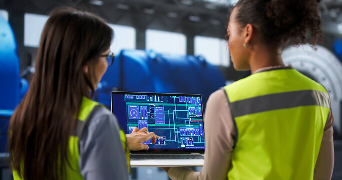 Diverse Female Engineers Checking Control System