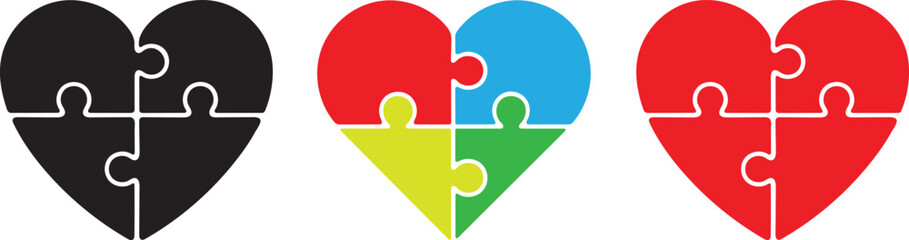 Three heart shaped jigsaw puzzles in black red and a colorful gradient