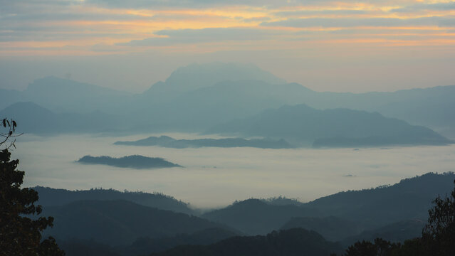 sunrise with moving of cloud and clear sky and layer of mountain