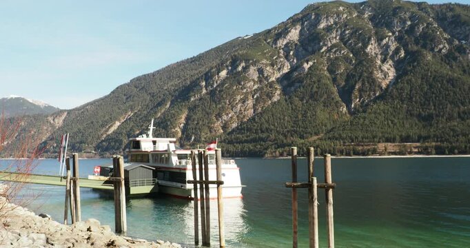 Lake Achen from Pertisau, city on the western shore. The cruise ferry pier facing the slopes of Klobenjoch on eastern shore
