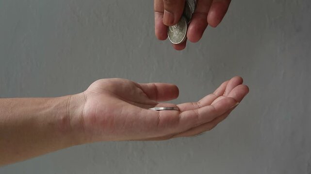 Giving and Receiving Indonesian Rupiah Coin Money