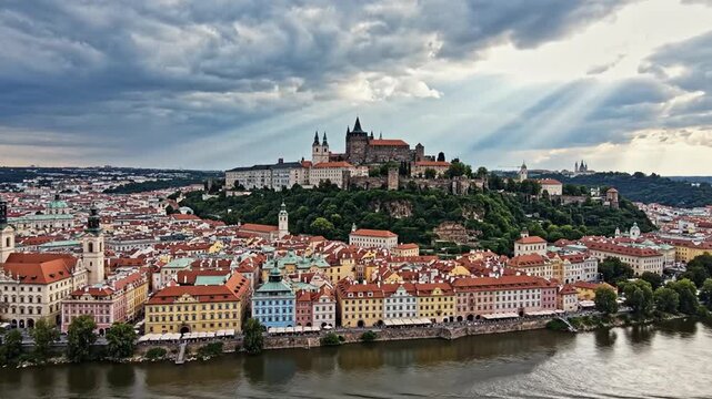 Prague cityscape with castle, Vltava River, and dramatic sky