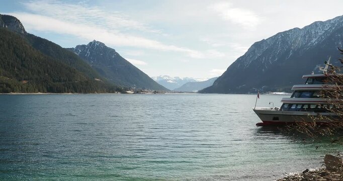Lake Achensee in Austrian Tyrol . Gaisalmsteig between Pertisau and Pr&auml;latenbuche on the western shore . View of Maurach am achensee between the slopes of the Ebnerjoch and B&auml;renkopf to the south
