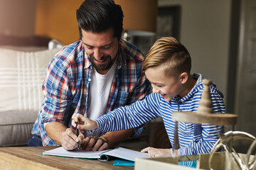 Naklejka premium Dad, kid and help with writing in home for learning support, fine motor skills or language activity. Education, father or child with lesson for handwriting practice, guidance and literacy development