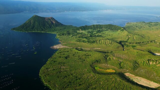 Classic establishing aerial shot of Taal Volcano and surrounding lake, ideal for documentaries, films, and travel visuals.