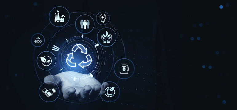 Hand holding circular economy and sustainability business concept with creative digital eco icons on futuristic background.
