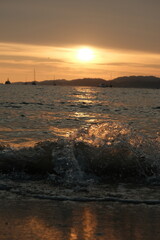 sunset at the beach with lower angle with waves 1
