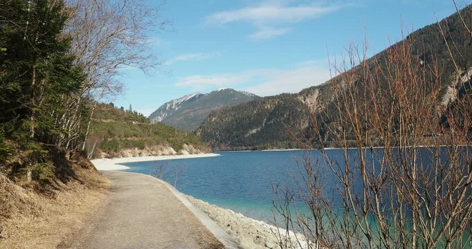 Walking trail along the western shore of Lake Achen (Achensee) between Pertisau, Gaisalm and Achenkirch heading north in a magnificent mountain setting of Austrian Tyrol
