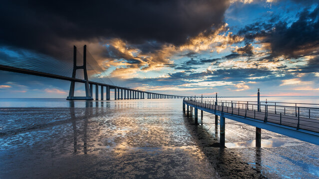 Golden Sunrise Reflection on Vasco da Gama Bridge