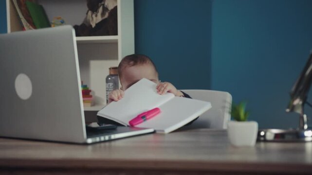 Young student engages with learning materials, Child concentrates on study materials and highlighting notes