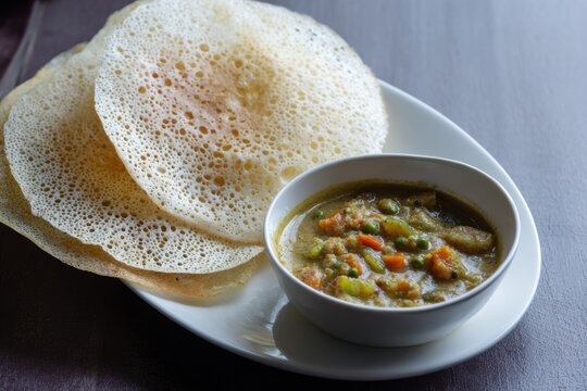 South Indian Appam with Vegetable Curry Traditional Breakfast Dish Close Up
