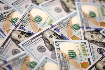 Money background with Franklin on the 100-dollar note. Texture of US dollar currency and banknotes. 100 USD bills. American hundred-dollar. Cash in dollar and credit theme with payment deposit money