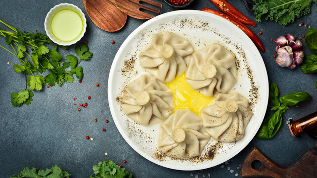 Boiled khinkali with lamb or beef or cheese. Traditional Georgian dish khinkali. Hinkali on a plate.