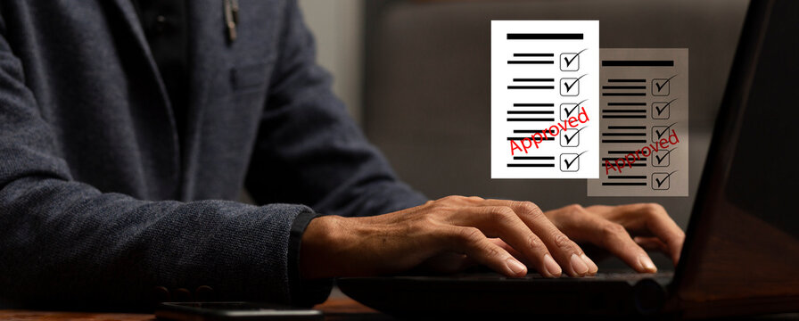 businessman work with laptop and review documen paperwork with checllist and approved at workplace, process cocument approved concept