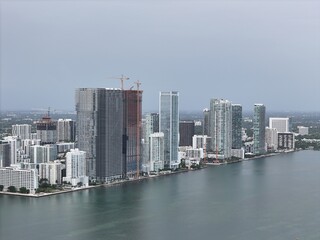 Obraz premium defaultMiami downtown skyline with modern high-rise buildings and a bridge over the bay under cloudy daylight. g.