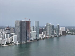 Obraz premium defaultMiami downtown skyline with modern high-rise buildings and a bridge over the bay under cloudy daylight. g.
