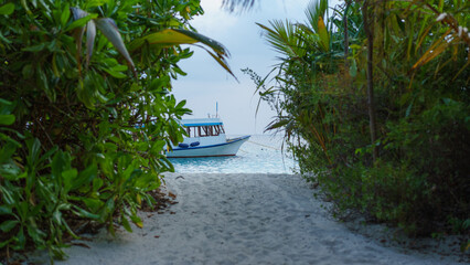 Diving boat by the beach in Maldives